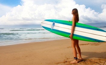 Surfer girl on the beach